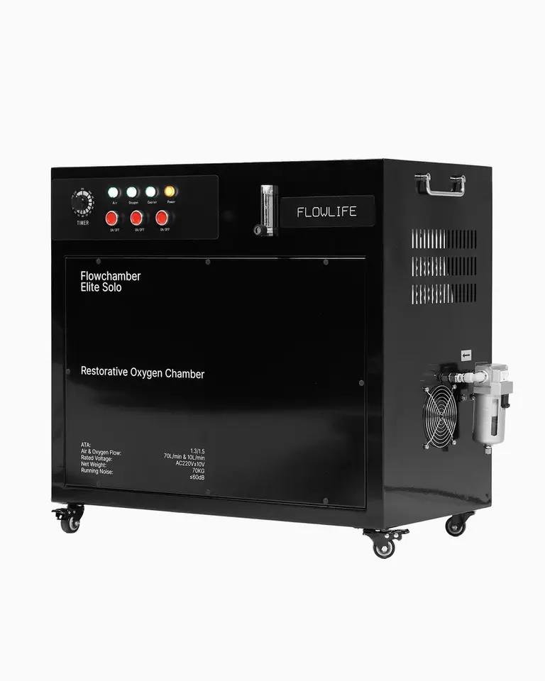Black all-in-one compressor for Flowchamber Oxygen Elite 170 with a control panel and casters.