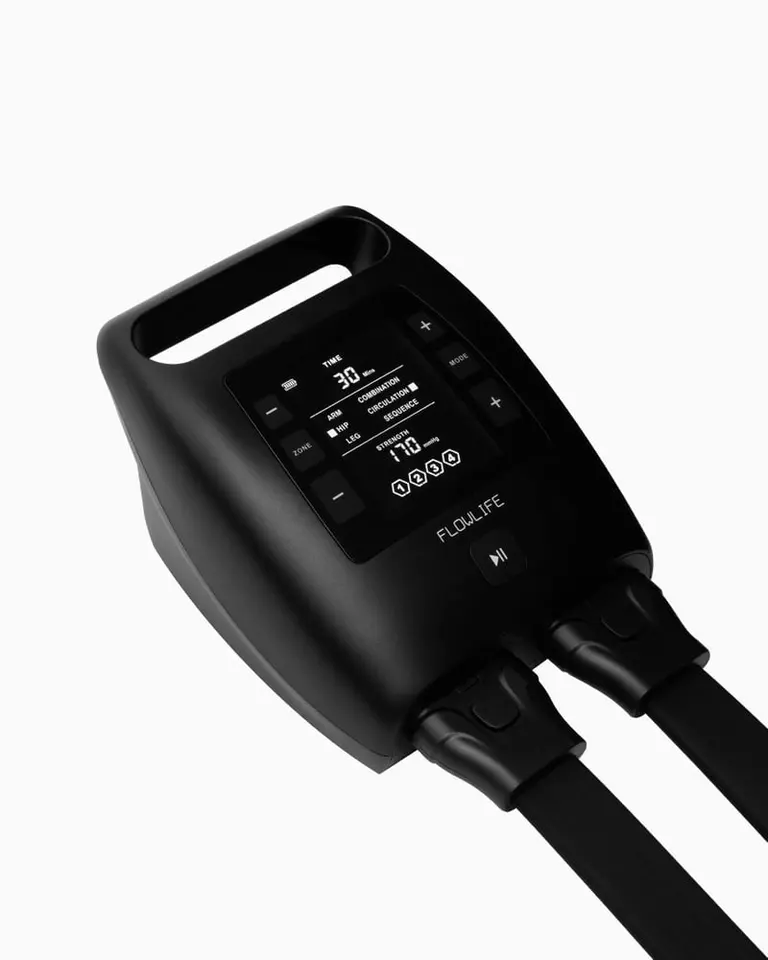 Black digital control unit for Flowpression Boots Pro+ showing compression modes and intensity settings.