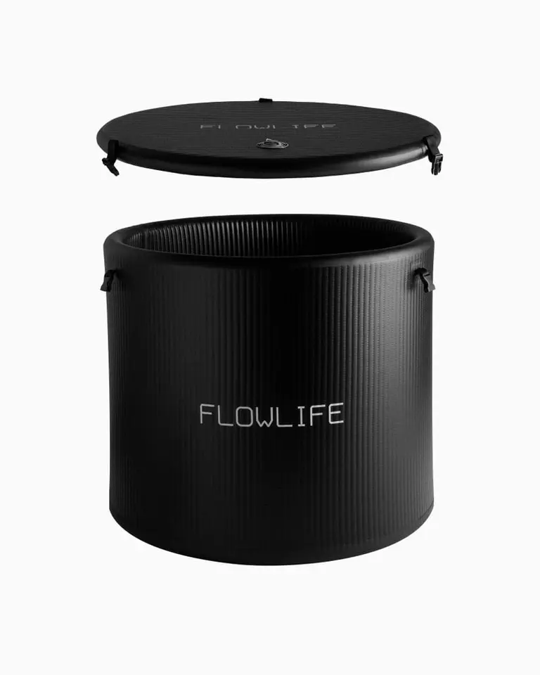 Black Flowplunge Pro cold plunge tub with reinforced drop-stitch walls and a matching protective lid for recovery.