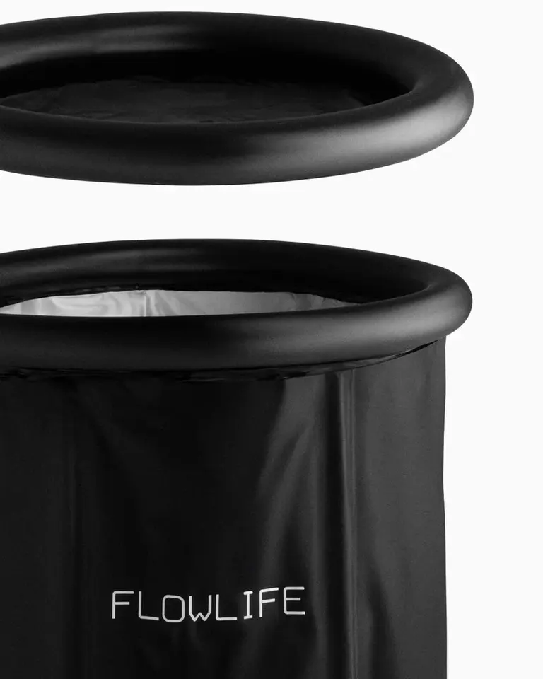 Detail view of the black Flowplunge Go portable ice bath and its matching insulated thermo lid for cold recovery.