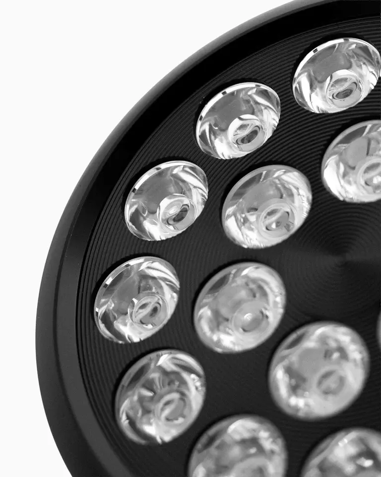 Close-up of the Flowlight Bulb 50 Six Waves showing circular emitters in a textured black housing for recovery.